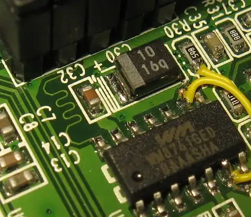 macro shot of a PCB with a squiggly trace on it