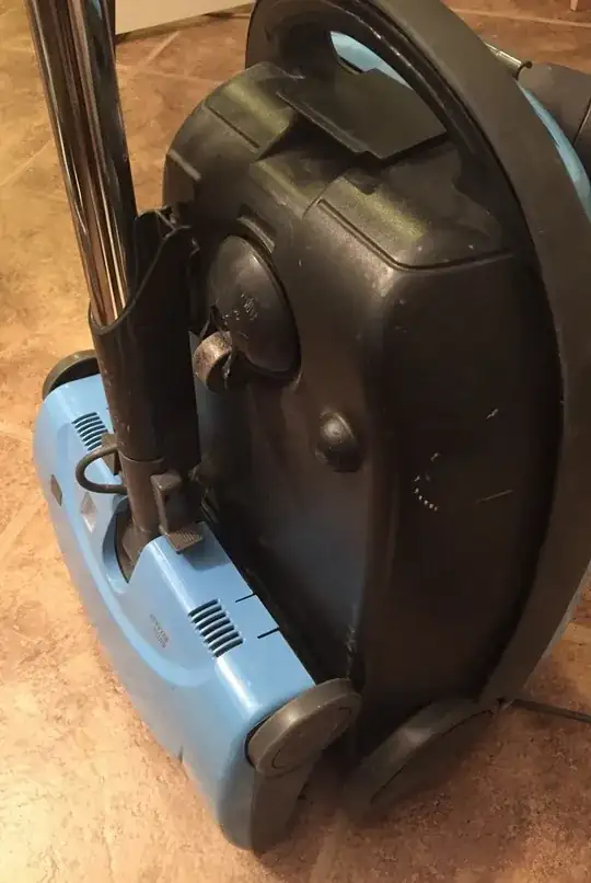 vacuum cleaner hose storage slot