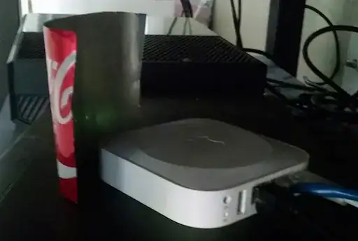 Airport router with carved up soda can