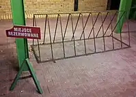 Triangle type bike rack with a capacity of 12 or so.