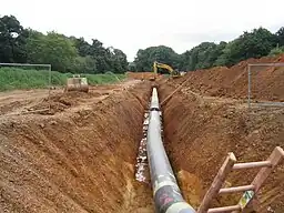Barton Stacey to Lockerley pipeline having been welded and tested the pipes are now being buried in a deep trench.