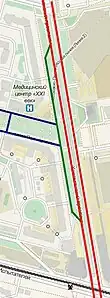 Adjacent roads (blue lines) connect only to a side road (Russian: карман, green line, tagged as side_road=rotary). There is no direct connection to the main carriageways (red lines).