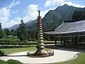 1/2 Form of a stone pagoda (man_made=tower and tower:type=pagoda) within a monastery.