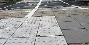 Plastic line used on railway crossings at train stations in the Netherlands (info in Dutch).