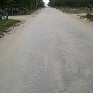 surface=compacted road with a minor damage.