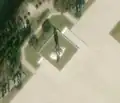 2/4 The same statue of Kim Il-sung (tourism=artwork and artwork_type=status) on its white base with the trees in the background which leaves a long shadow on the satellite imagery (satelliteimage Maxar).