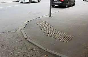 tactile pavement to orient the user in the direction of the crossing