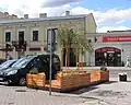 Parklet with seatings and plants.