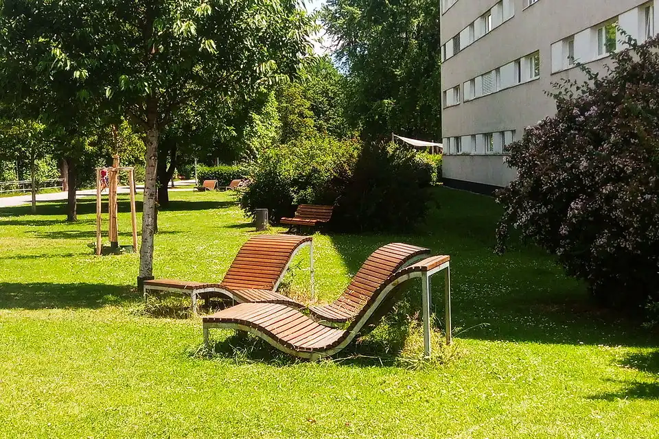 Several wave loungers of seats=1-2 in a park