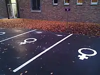 Women only parking next to the entrance. Marked with a painted "♀", symbol representing female.