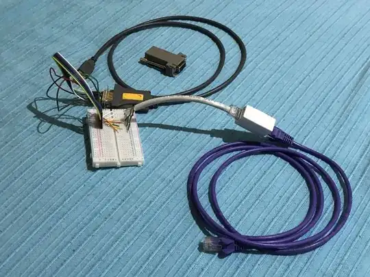 RJ45-DB9 adapter wired on breadboard