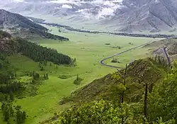 View of the village (in the background) from the chike-taman pass