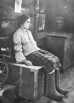 Girl sitting. Still from the film.