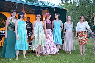 Polish women wearing boho- or hippie-inspired dresses, floral prints and peasant blouses, 2014.