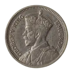 A coin featuring a crowned bust of King George V.