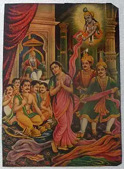 Duryodhana attempts to disrobe Draupadi in front of the Pandavas, while Krishna protects her