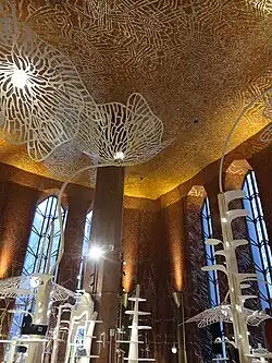 The Red Room, photographed in 2025 after the Printemps store opened there. The room has various shelves shaped like plants, which display women's shoes.