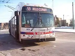 alt3=On the roof of the trackless trolley two poles rise up to contact overhead wires.