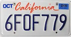A California license plate with blue text on white background. On the top reads “California” in red.