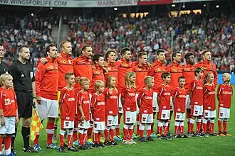 Player escorts with the Austrian national team before a friendly against Greece in 2018.