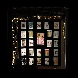 An Advent calendar consisting of images that have dates on the inverse side