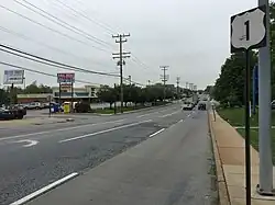 View north along 3400 block of Wilkens Avenue in Baltimore, with commercial buildings in Saint Agnes to the left
