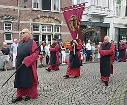 Confraternity of the Holy Cross with banner