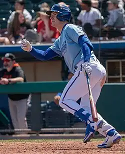 Mark Canha batting in an Omaha Storm Chasers uniform