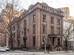 The Isaac Newton Phelps house at 231 Madison Avenue, a brownstone house, as seen from diagonally across Madison Avenue and 36th Street