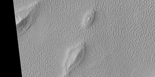 Layered features in Lycus Sulci, as seen by HiRISE under HiWish program