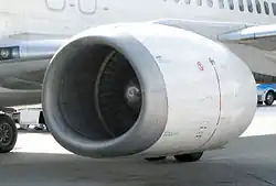 A close-up view of a CFM56-3–series engine mounted on a Boeing 737-400, showing flattening of the nacelle at the bottom of the inlet lip