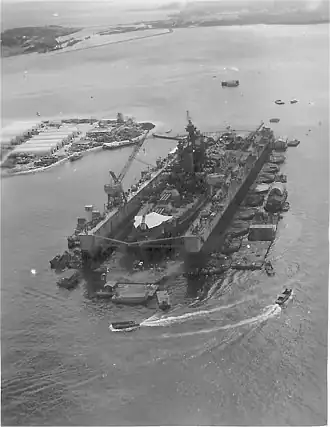 USS ABSD-3 at Guam ca. September 1945 repairing USS Pennsylvania (BB-38), to the rear right of ABSD-3 is the land base that supported the ABSD-6 and ABSD-3 crews