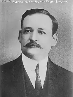 A back-and-white portrait photograph of Alfonso Quiñónez Molina