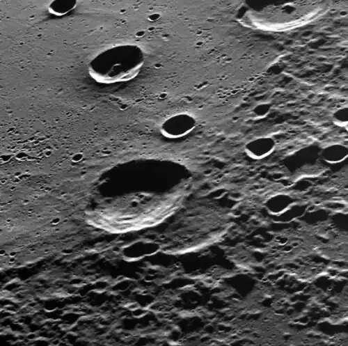 Anguissola is shown on the rim of the large crater Henri
