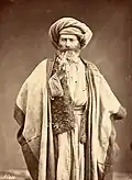 Arab man with a pipe, 1880s