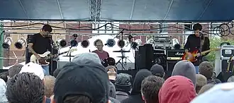 Arcwelder performing at Touch and Go Records' 25th anniversary in 2006. Left to right: Rob Graber, Scott Macdonald, and Bill Graber.