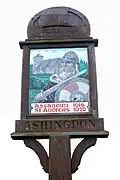 Village sign showing St Andrew's church and King Canute