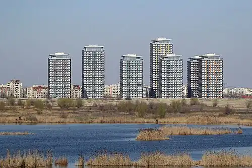 Tower blocks near Văcărești Nature Park, Bucharest, 2006–2010, by Călin Negoescu, Cristina Găleată, Ștefan Cătălin, Cristian Craiveanu, Alexandru Cutelecu[134]