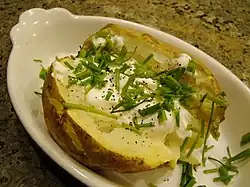 Baked potato with sour cream and chives