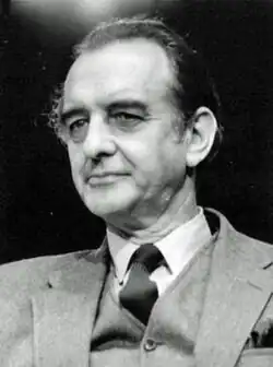 Clean-shaven middle-aged man in suit and tie