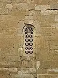 Visigothic window with stone tracery, of Church of San Juan Bautista, Baños de Cerrato, 7th century