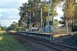 The tired single platform of Baxter station in a rural environment