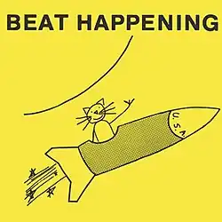 A drawing of a kitten riding on a rocket ship against a yellow background with the band's name at the top