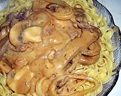 Beef Stroganoff atop pasta