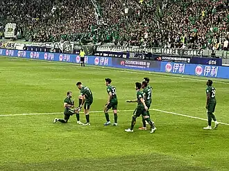 Guga and teammates celebrating the team’s second goal against Shenzhen Peng City on 10 May