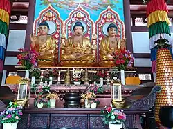 Statues of Bhaisajyaguru (left), Gautama Buddha (middle) and Amitābha (right) at the Mahavira Hall.