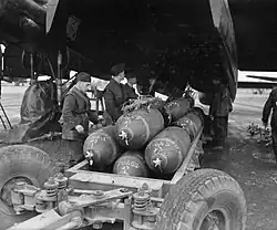 Avro Lancaster at RAF Metheringham. Note the "Fuzed" status, chalked on the nose of each bomb