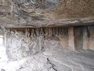 Reclining Buddha and other reliefs