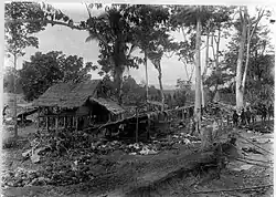 Another view of Dutch soldiers at the fortified village of Kute Rih among dead Alas people