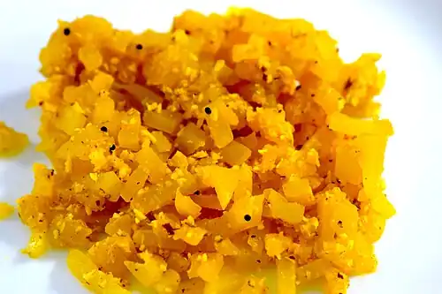 Pappaya Thoran, Kerala dish with papaya and scraped coconut fried in coconut oil.